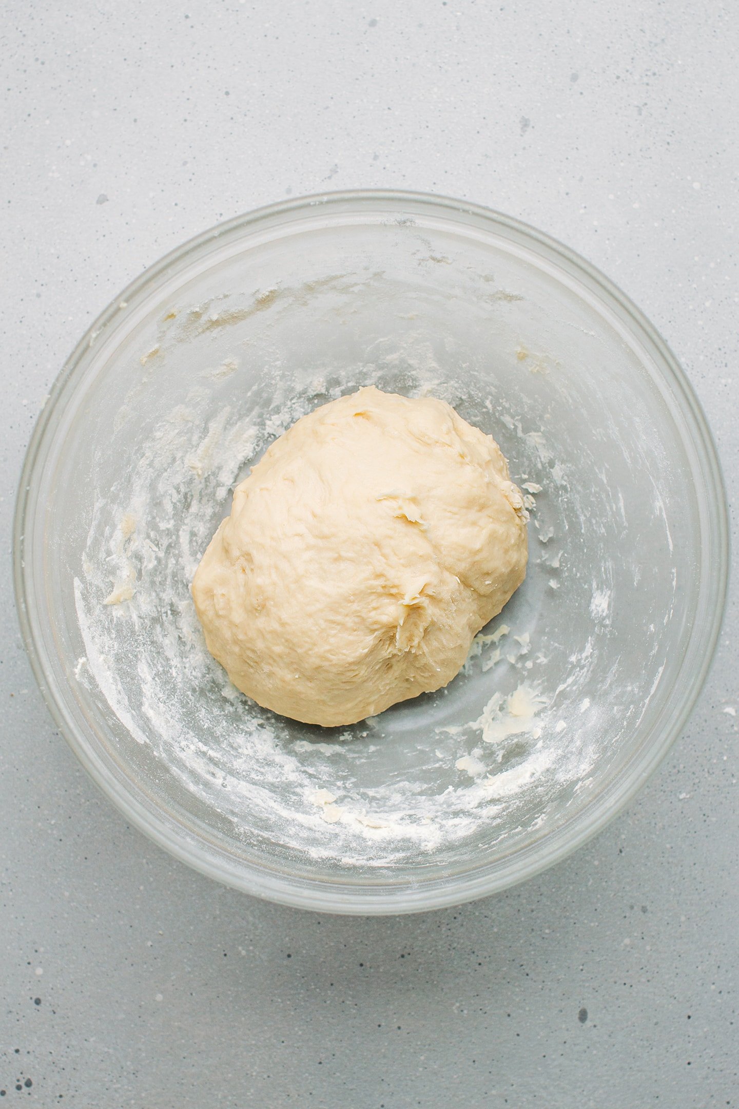 Ball of dough in a mixing bowl.