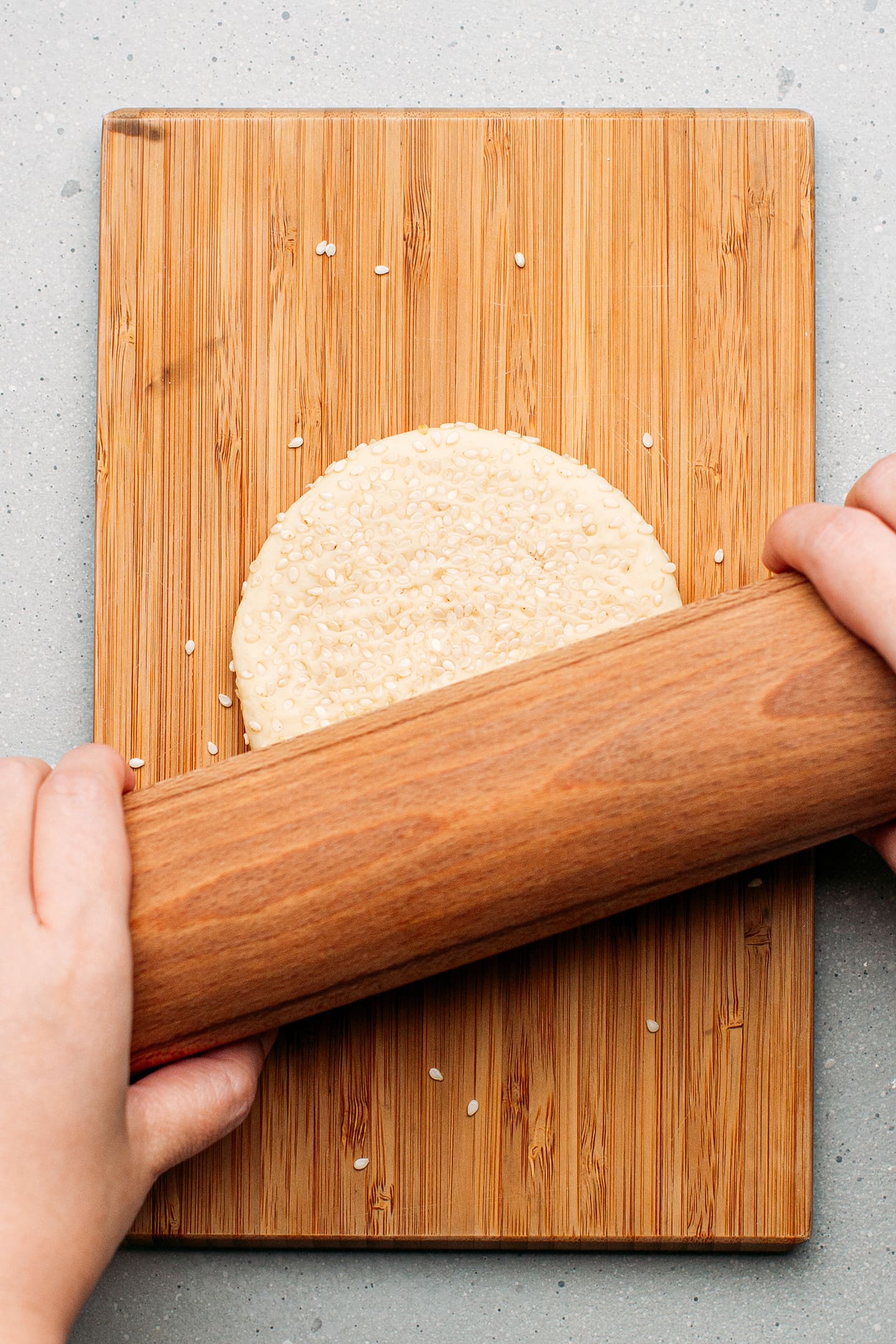 Flattening dough into a disc.