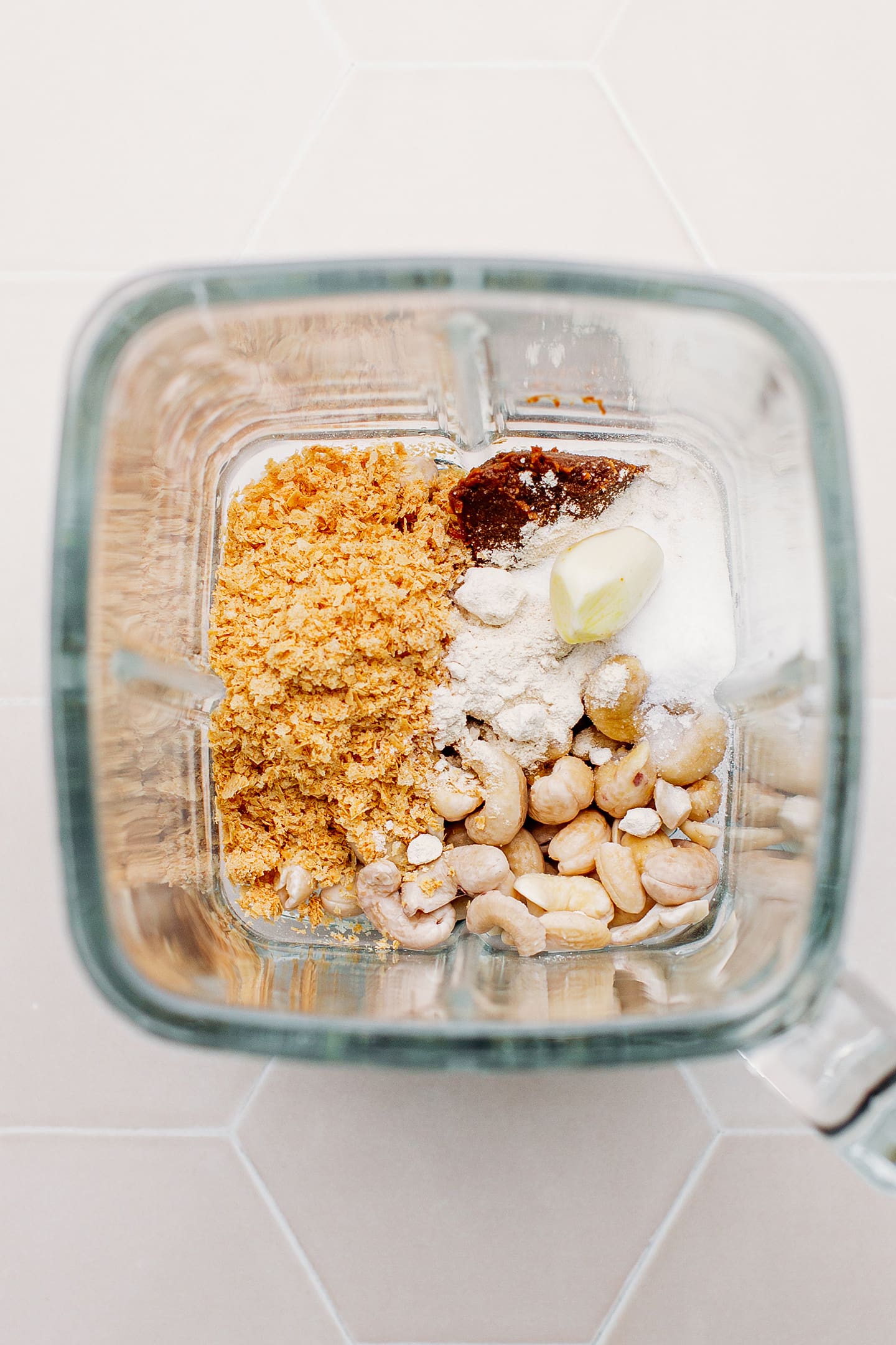 Raw cashews, nutritional yeast, miso, and salt in a blender.