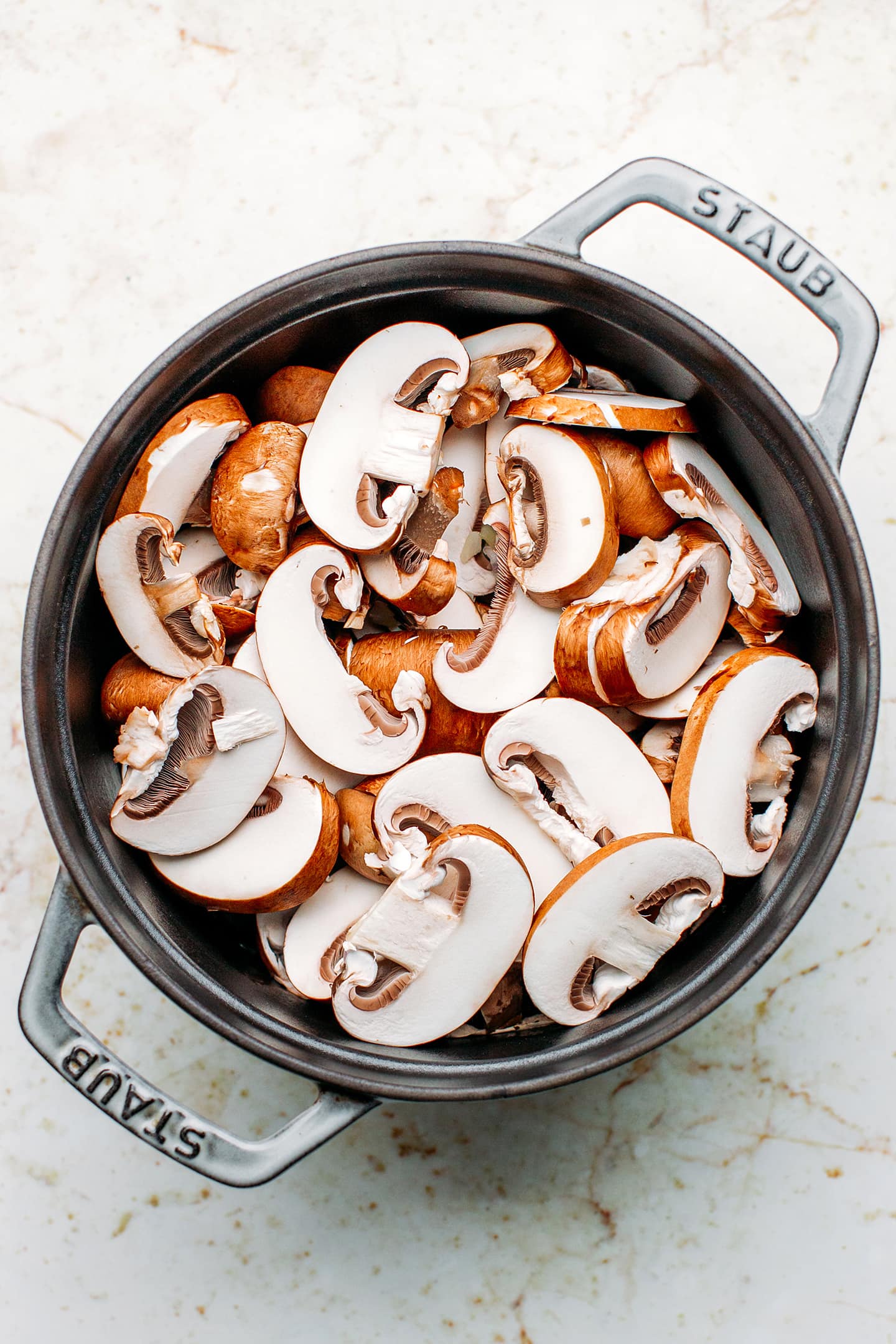 Sliced mushrooms in a pot.