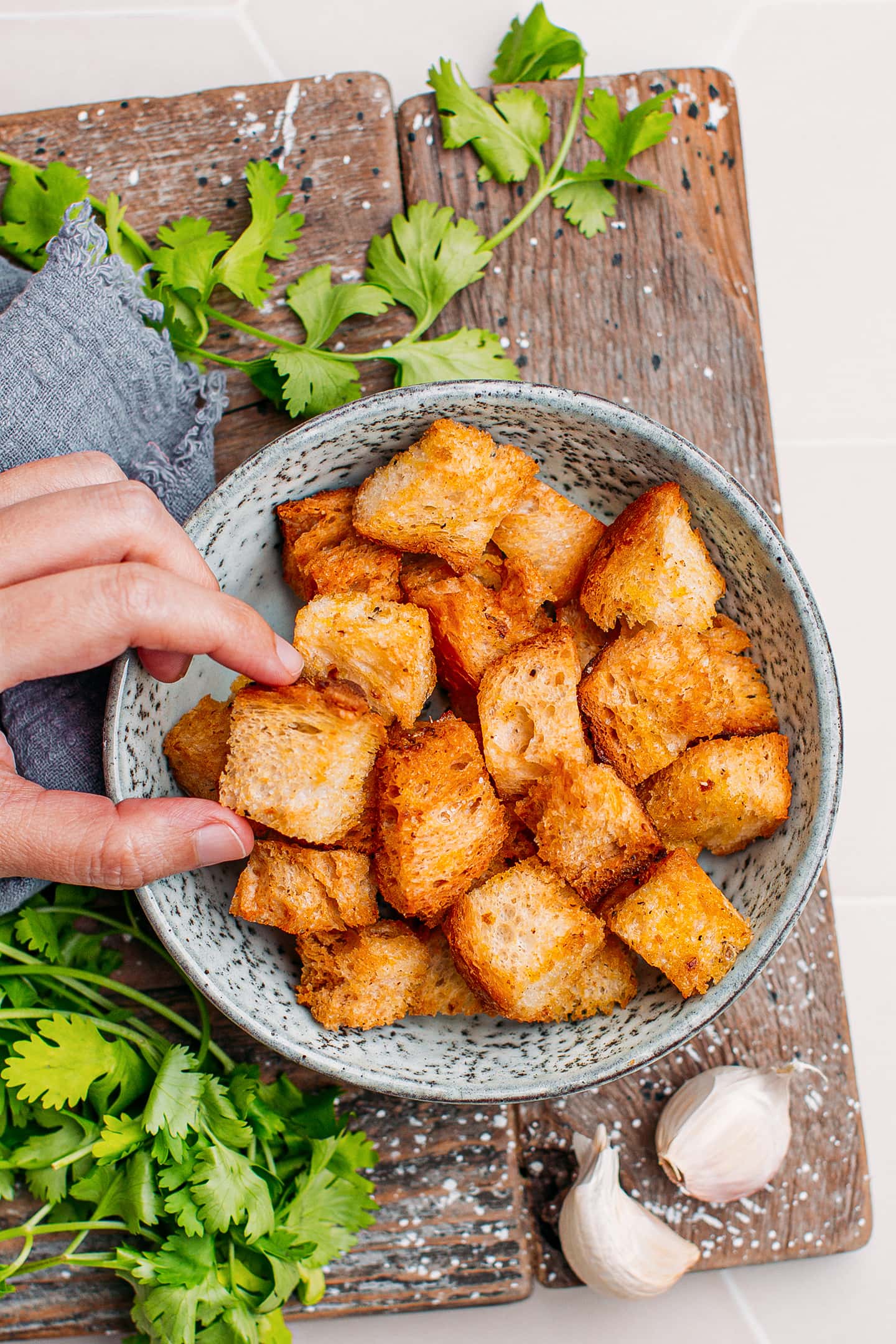 Golden brown croutons in a small bowl.