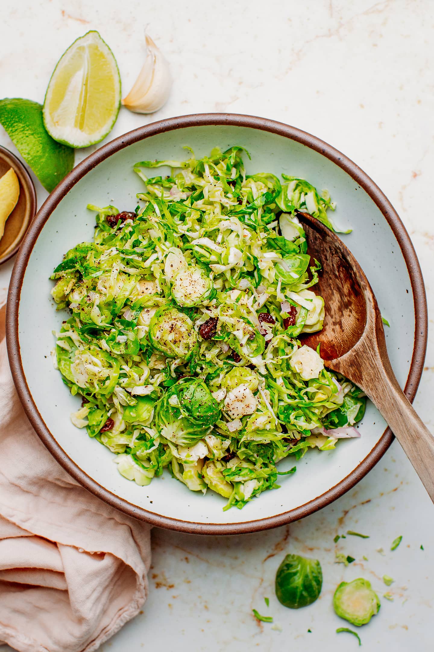 Brussels sprout salad with shallots, ginger, and raisins.