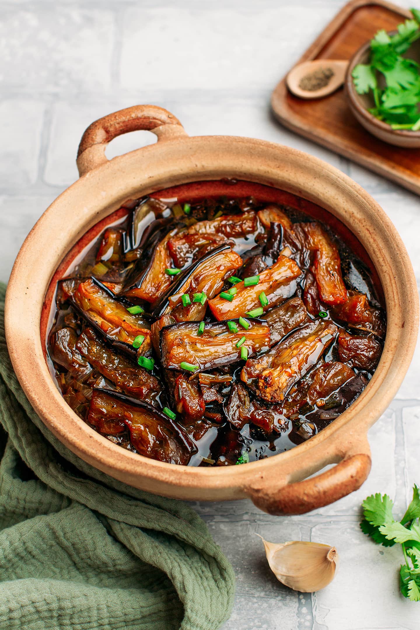 Braised eggplants in a clay pot.