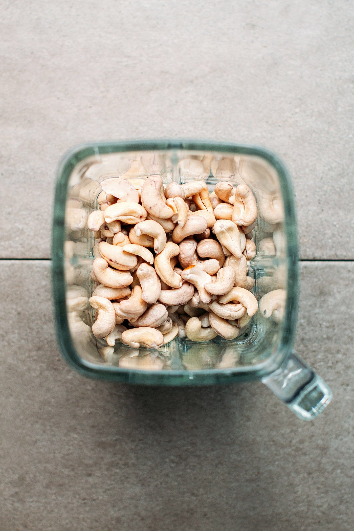 Soaked cashews in the bowl of a blender