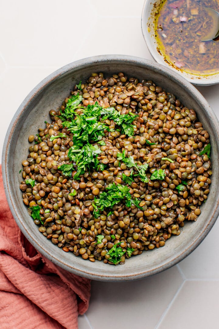 Cooked green lentils in a bowl.