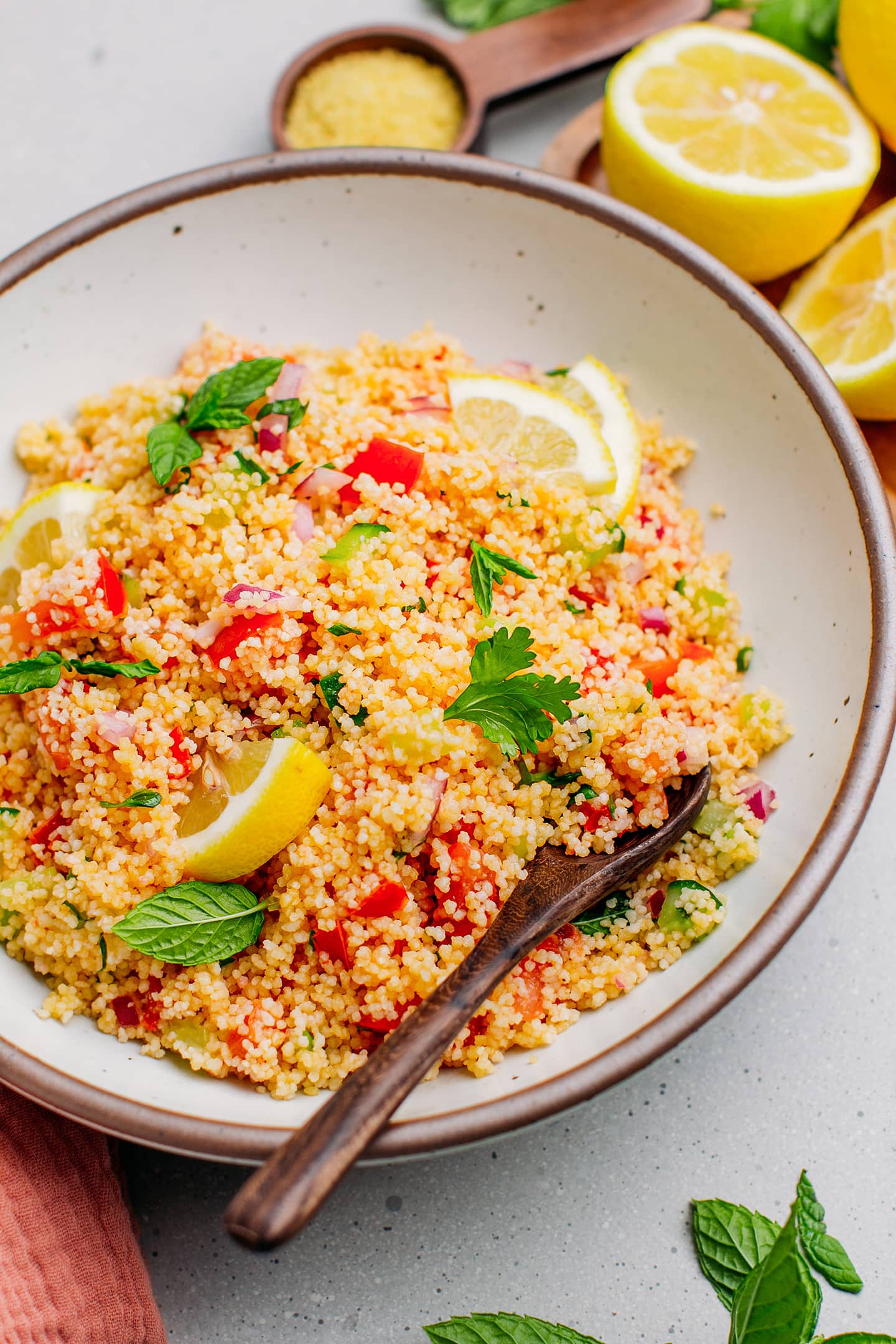 Couscous salad with tomatoes, cucumbers, and fresh herbs.