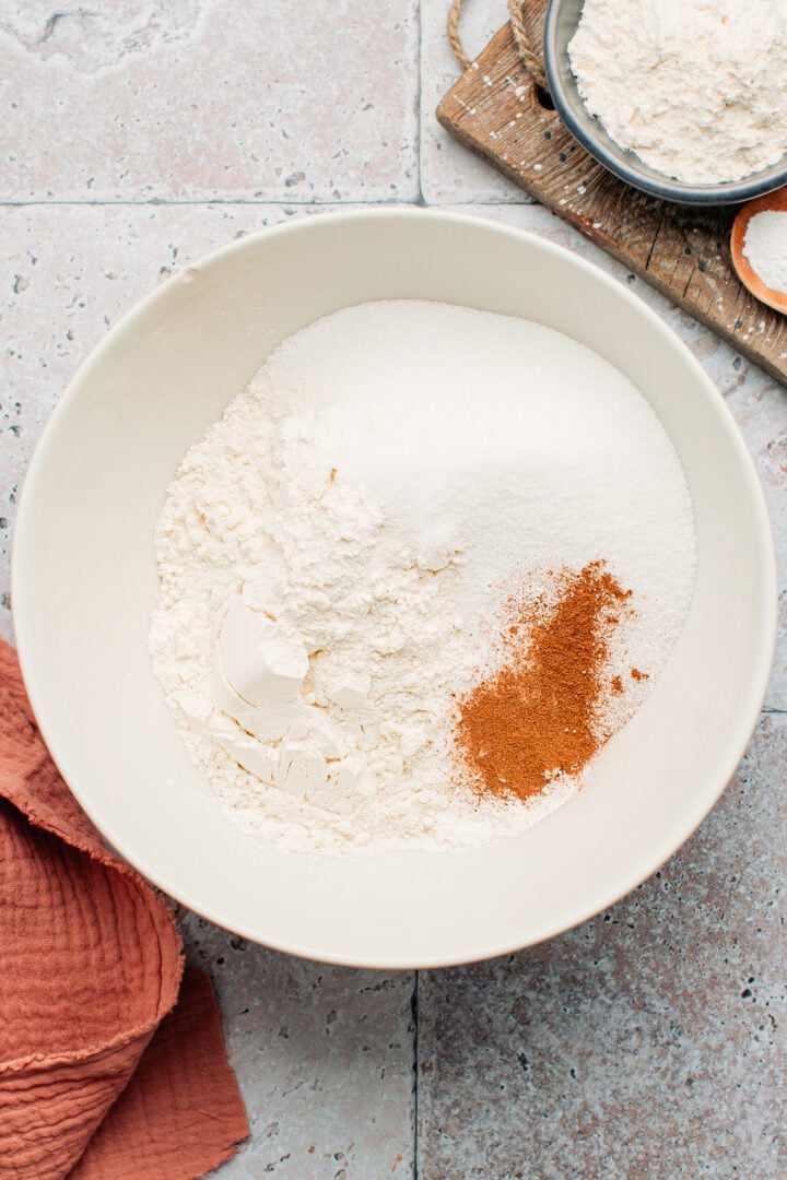 Flour, sugar, and cinnamon in a mixing bowl.