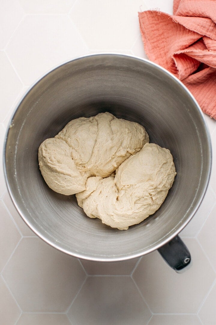 Seitan dough in the bowl of a stand mixer.