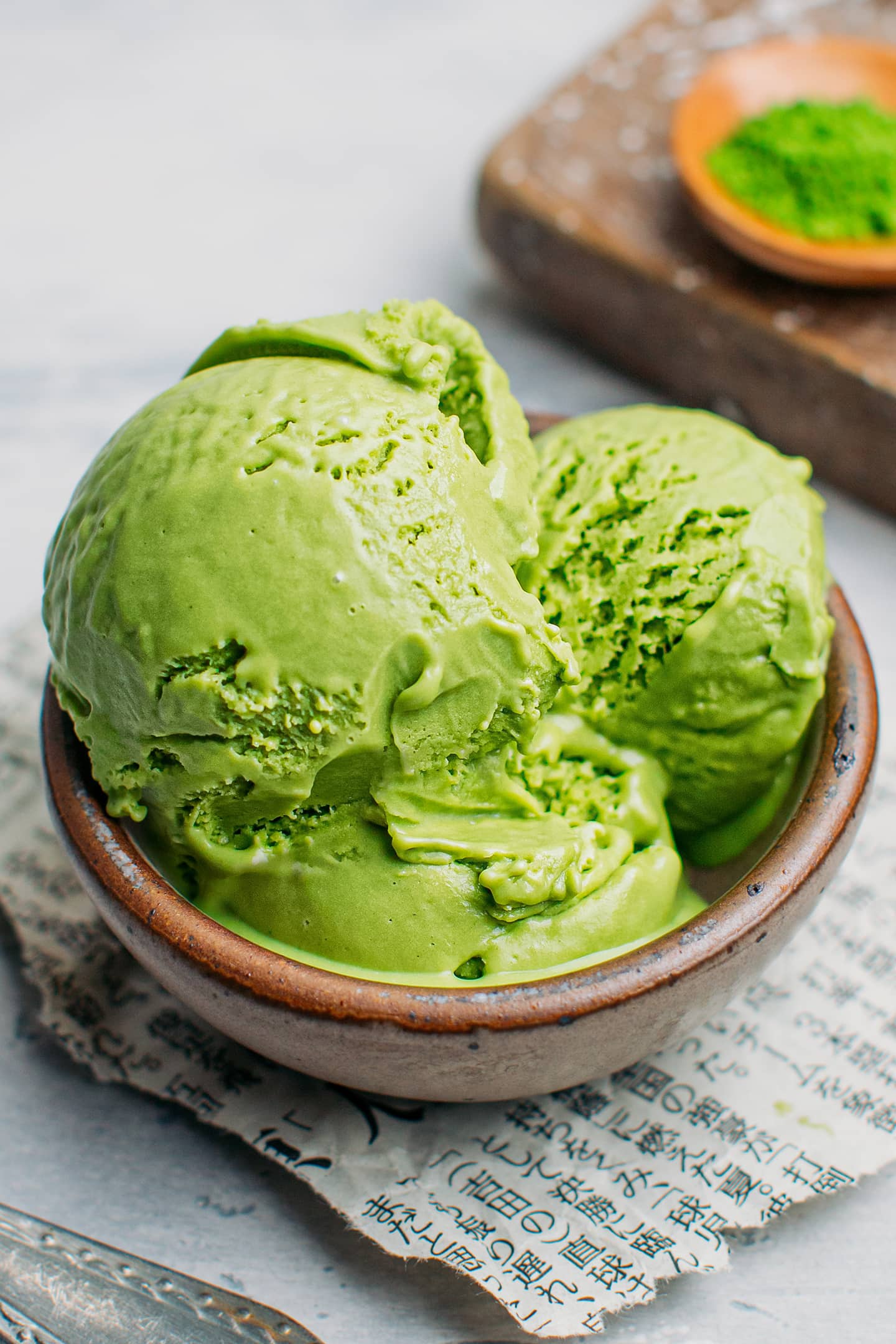 Scoops of vegan matcha ice cream in a bowl.