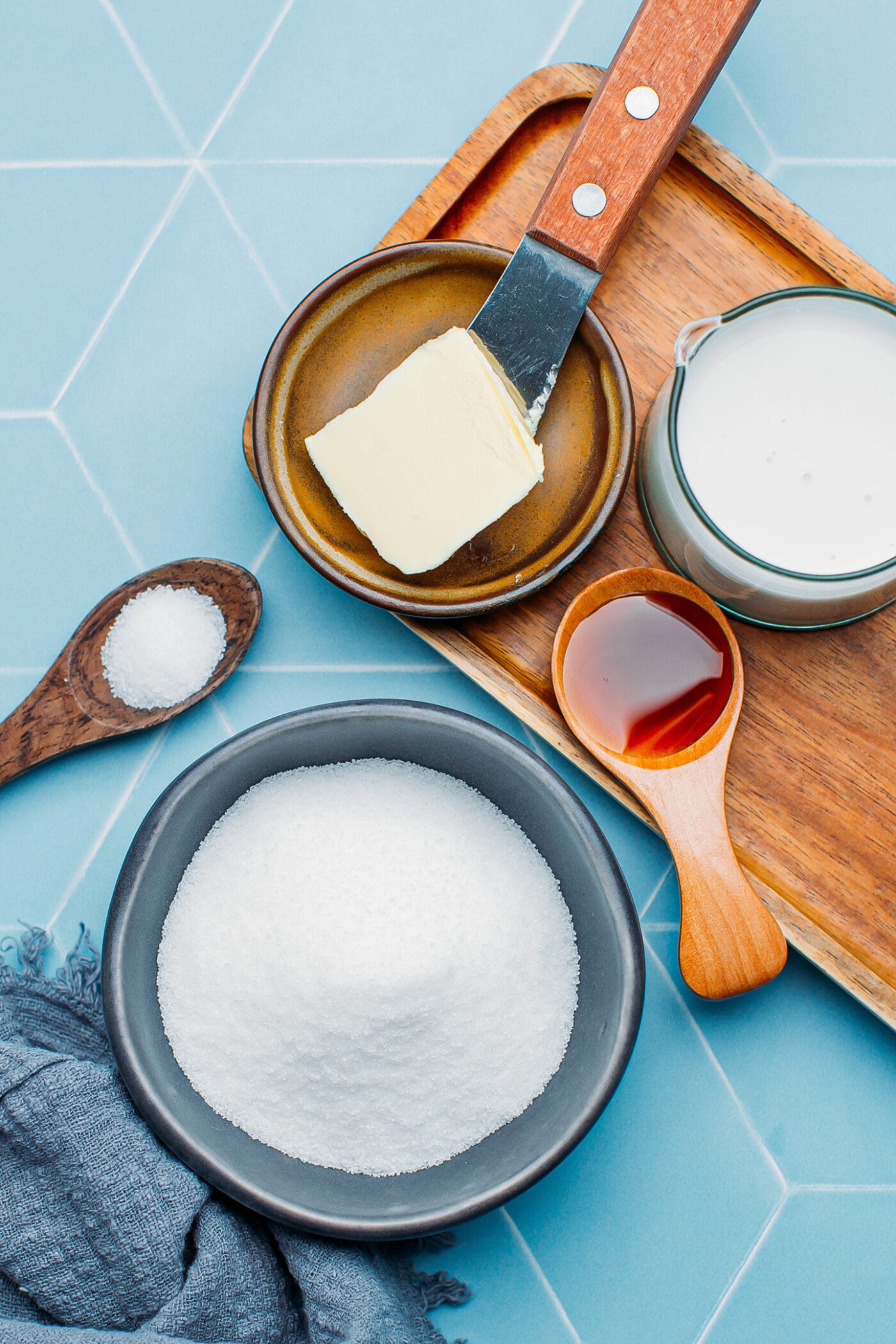 Ingredients like sugar, butter, coconut milk, salt, and vanilla extract.