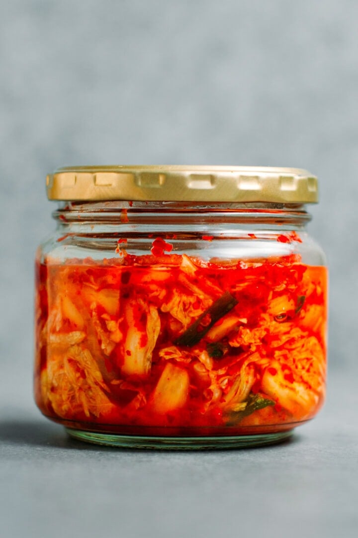 Kimchi fermenting in a jar.