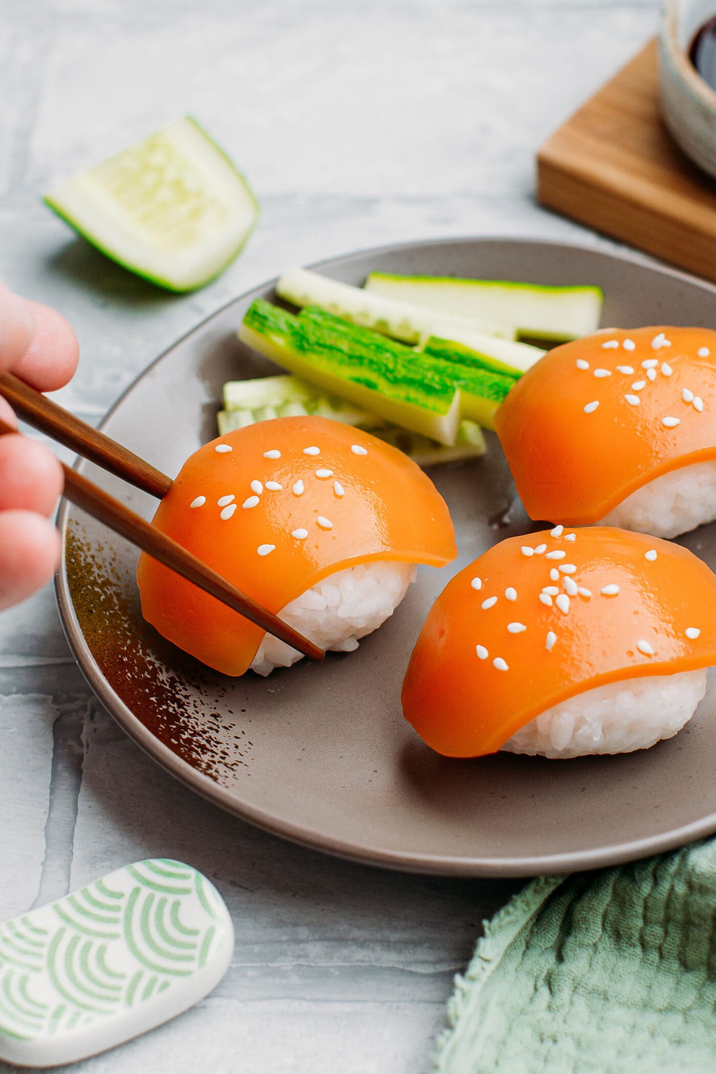 Vegan salmon sashimi on top of sushi rice.