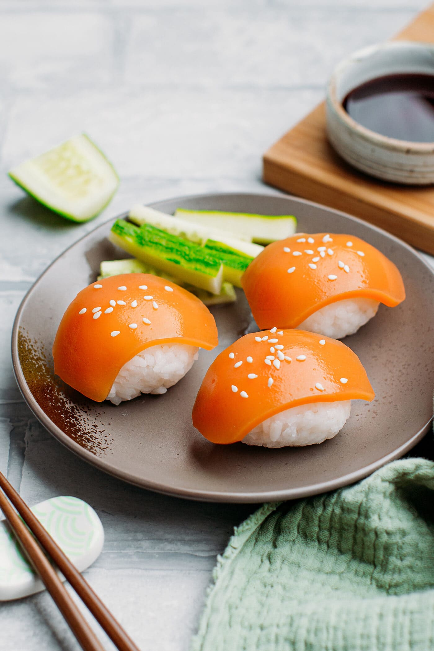 Vegan salmon nigiri on a plate.
