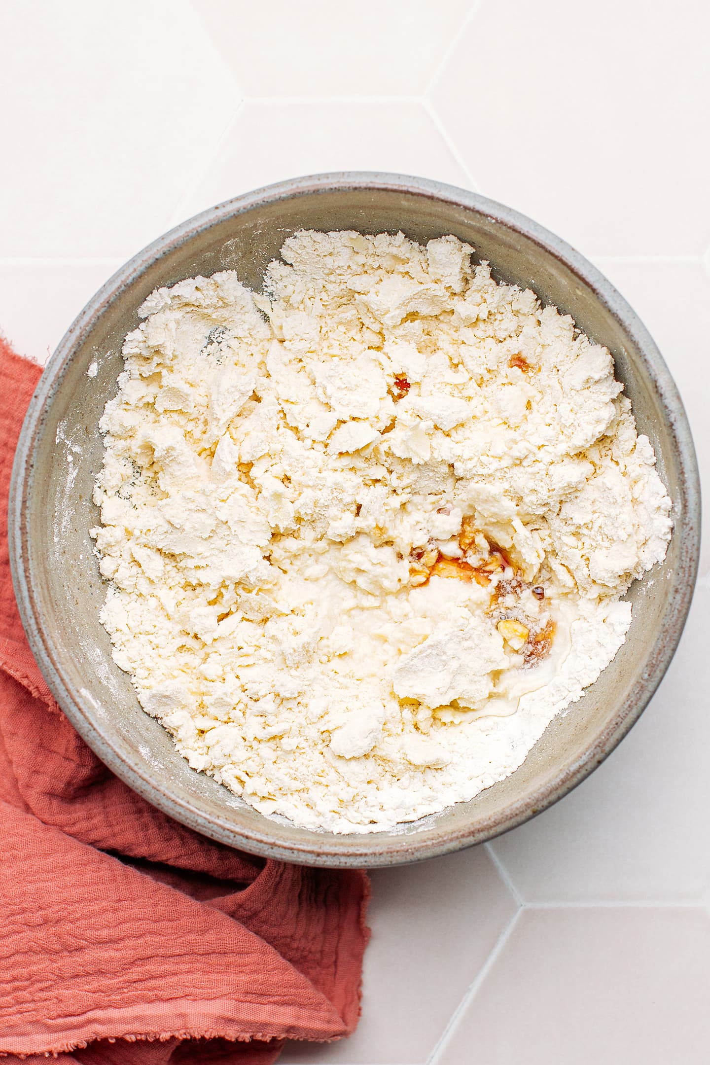 Flour, water, and butter in a mixing bowl.