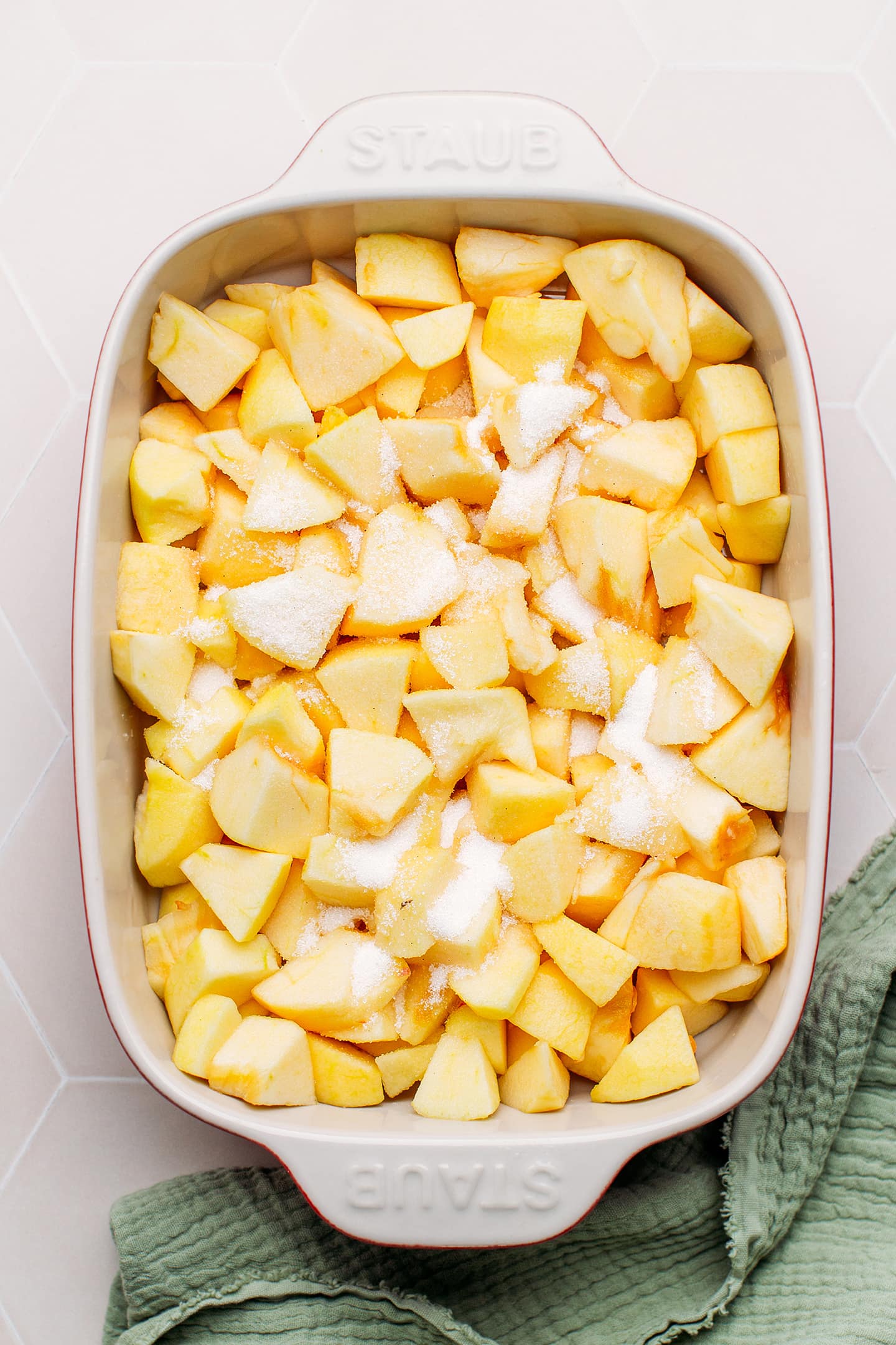 Diced apples in a baking dish.