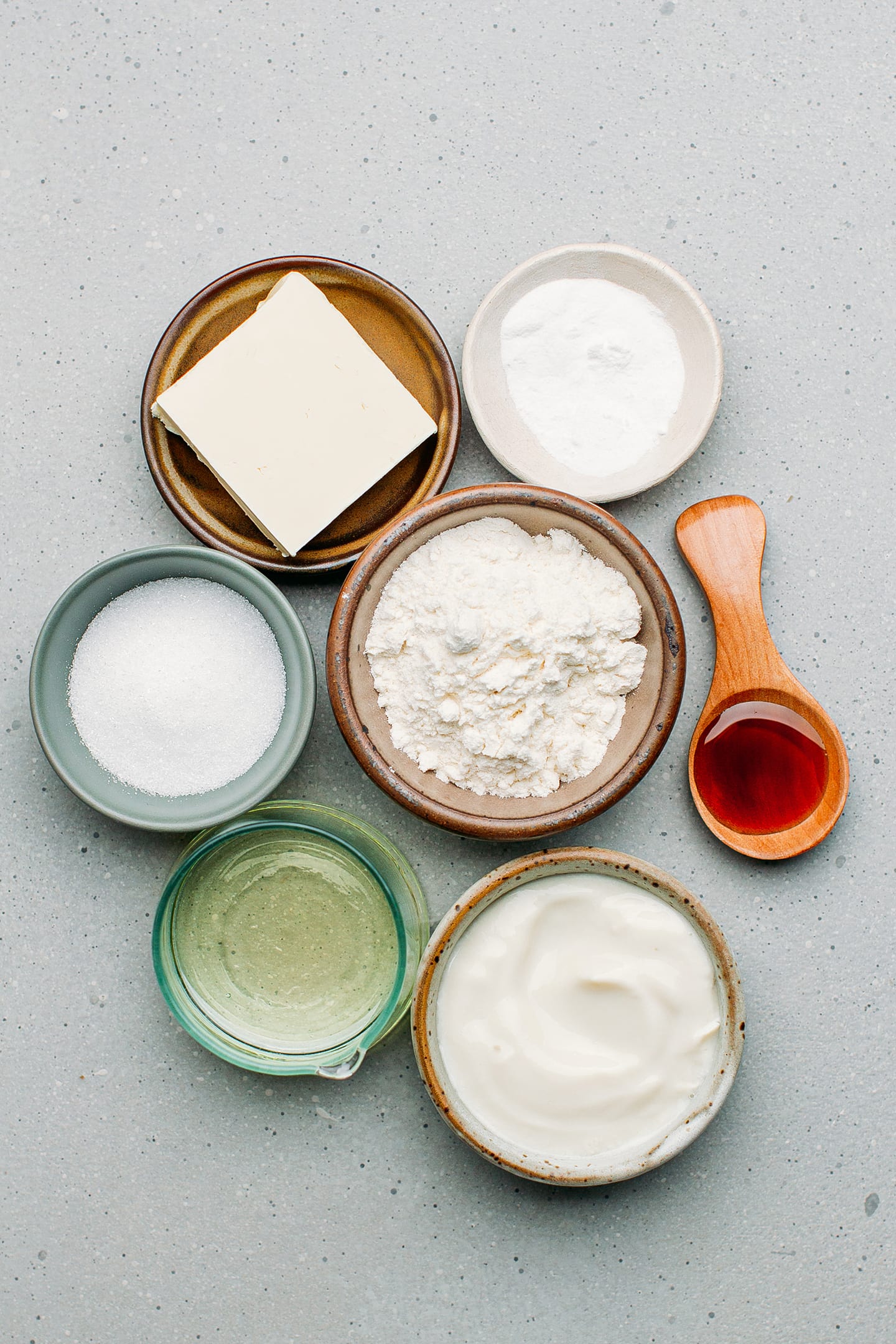 Ingredients like flour, butter, yogurt, oil, and sugar.