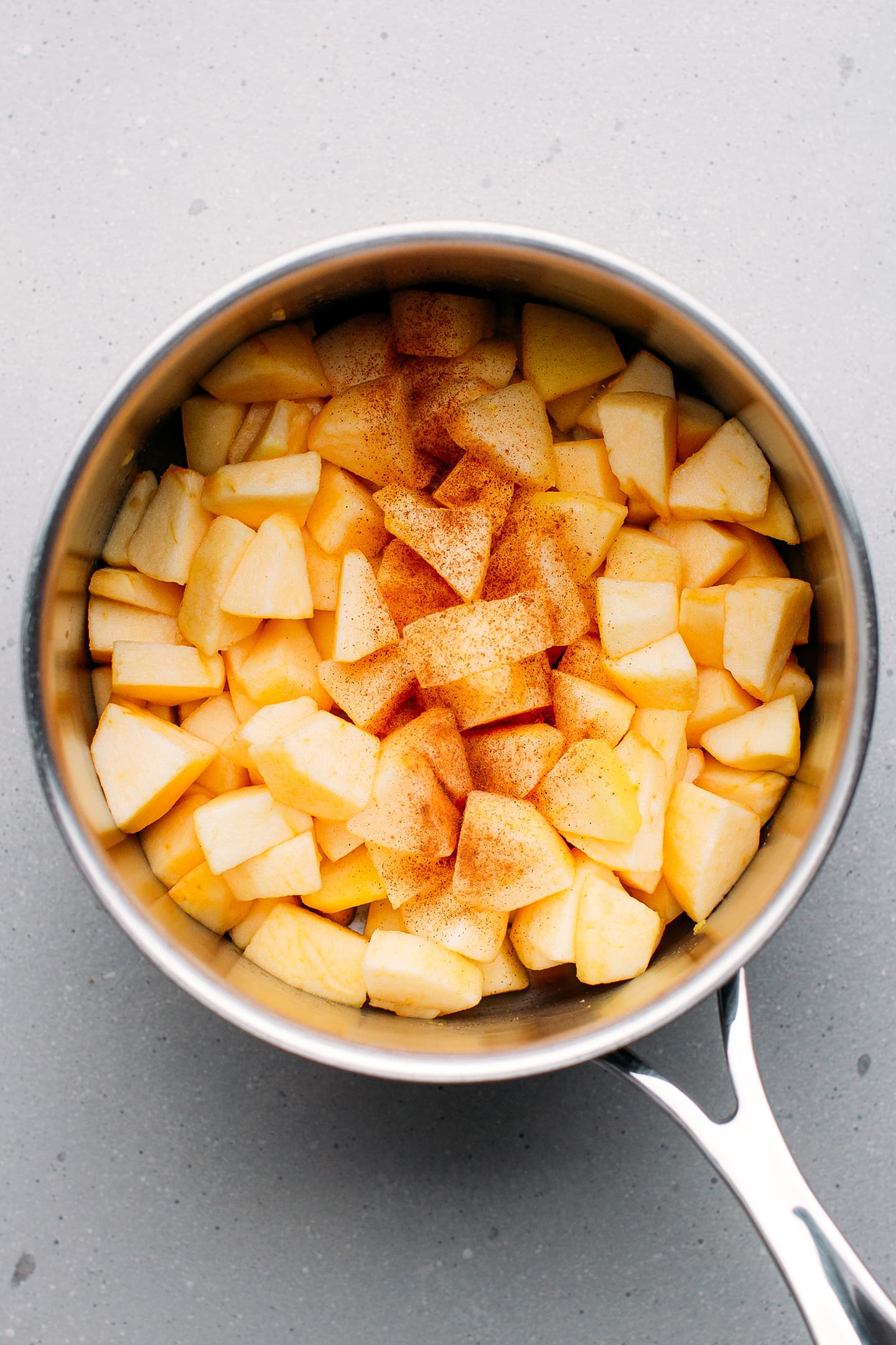 Diced apples in a saucepan.