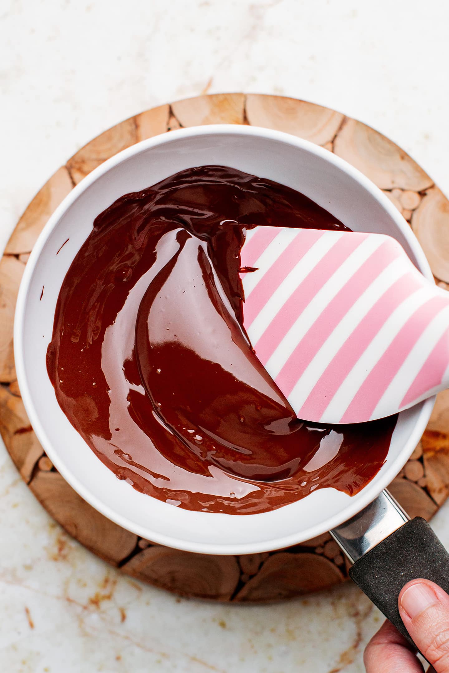 Melted dark chocolate in a bowl.