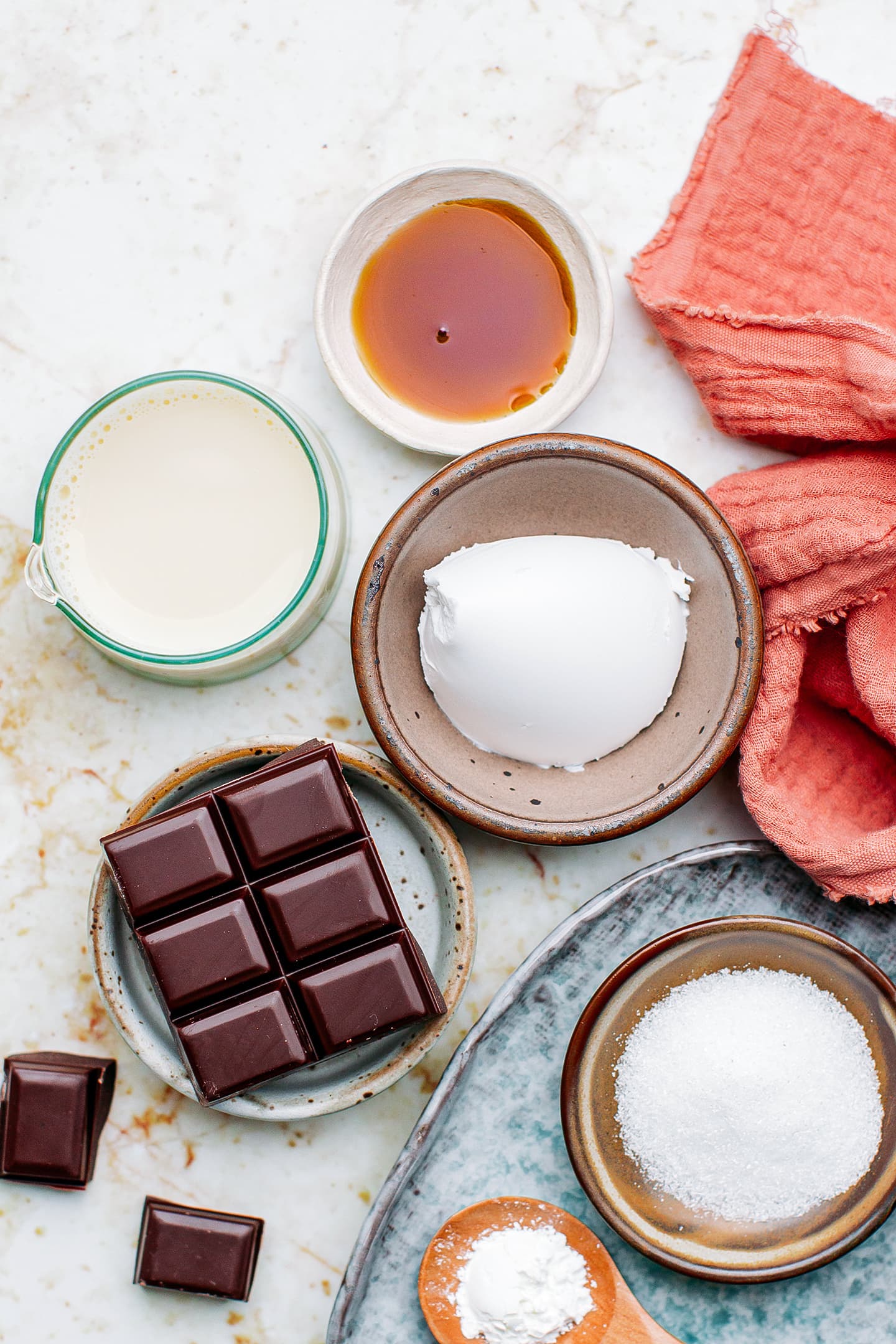 Ingredients like dark chocolate, coconut cream, sugar, and almond milk.