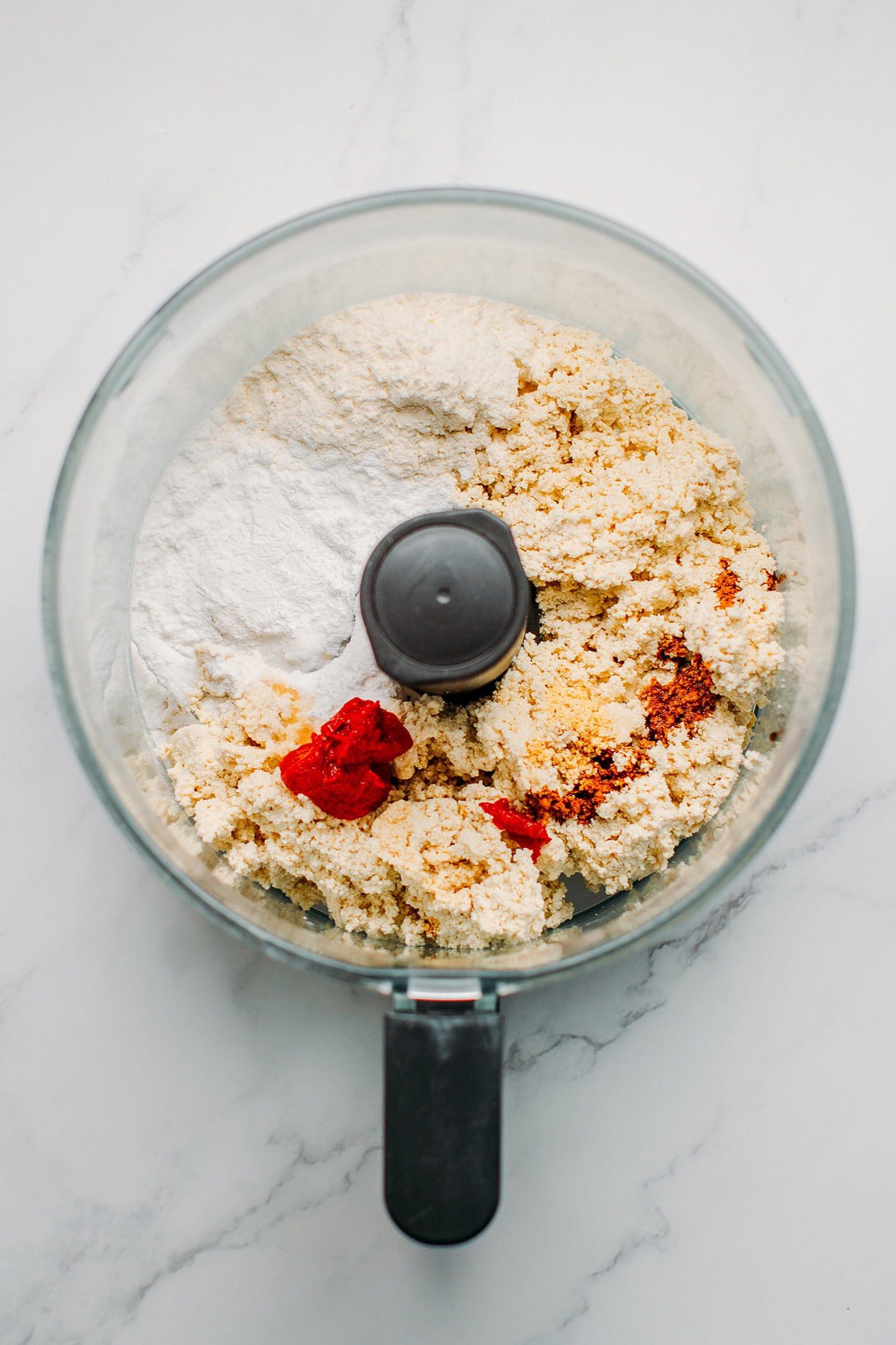 Tofu, flour, tapioca starch and spices in a food processor