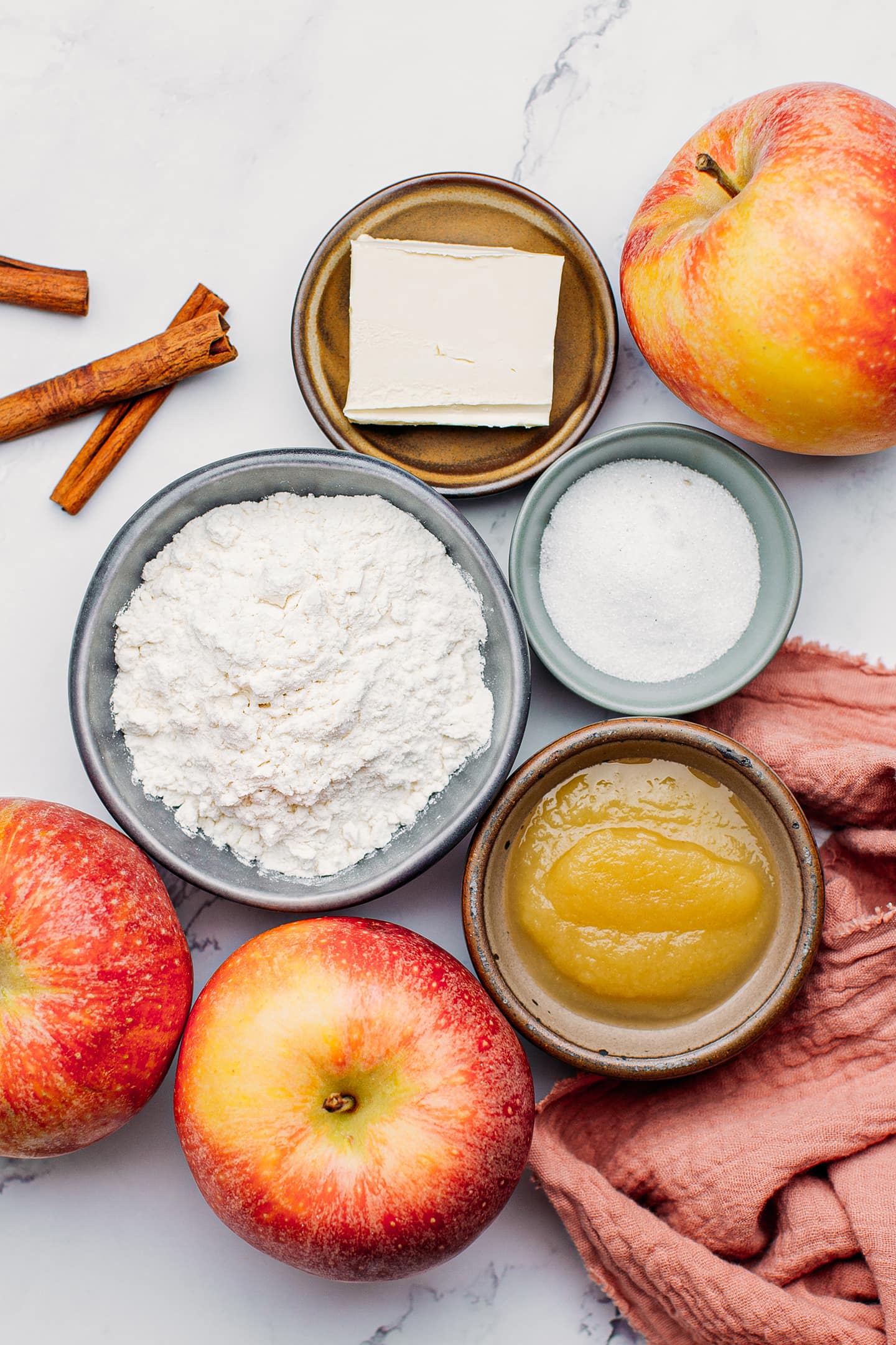 Ingredients like flour, apples, applesauce, and sugar.