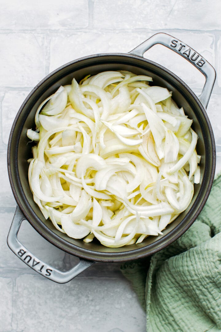 Sliced onions in a pot.