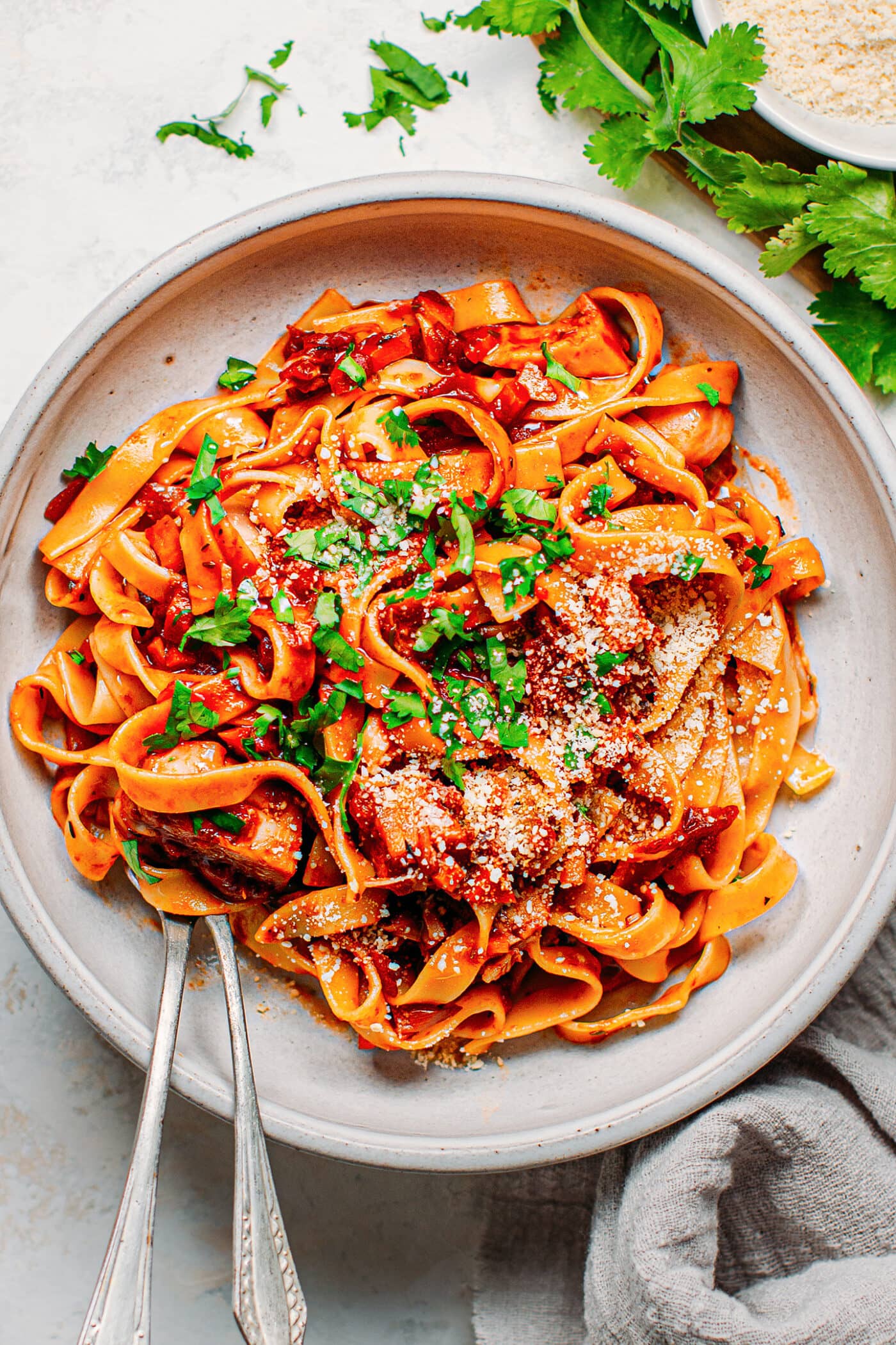 Vegan ragu pasta with jackfruit, parsley, and parmesan.