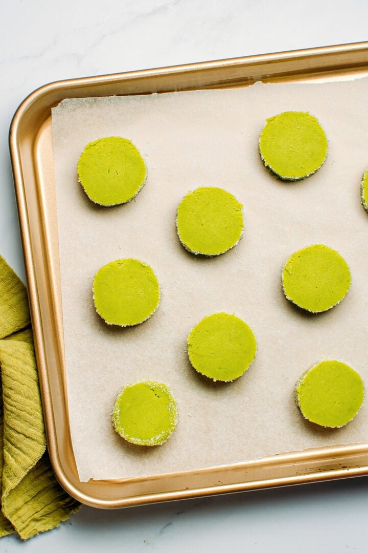 Matcha diamond cookies on a baking sheet.